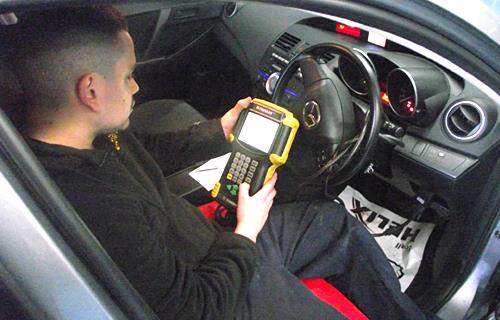 An Auto Tech Service Centre technician running dealer-level diagnostics in Sunshine West